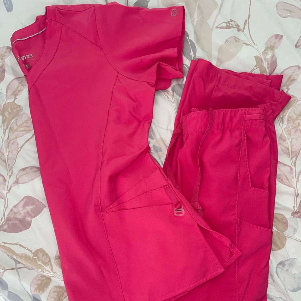 Bright pink wonder wink scrubs. Size small